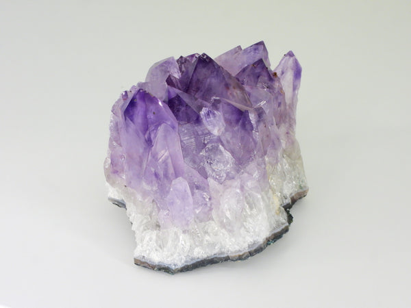 Beautiful Amethyst cluster with inclusions. Side view