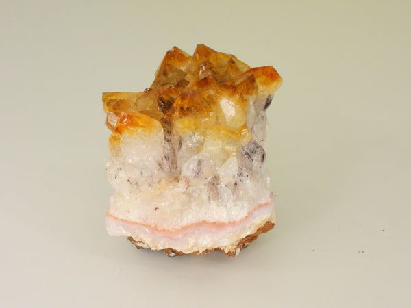 Beautiful Citrine cluster with inclusions. Side view