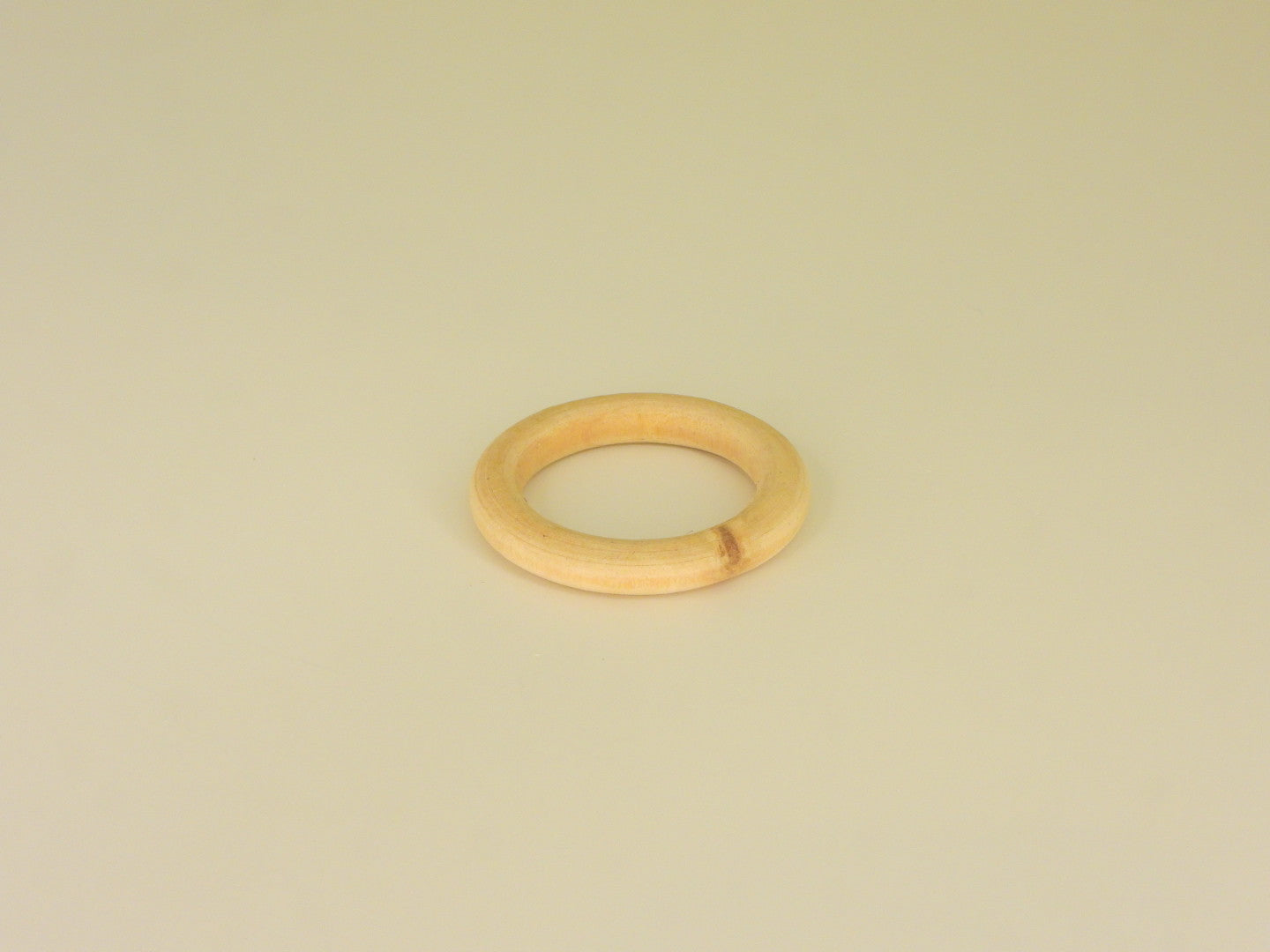 Small wooden ring sphere stand. Front view