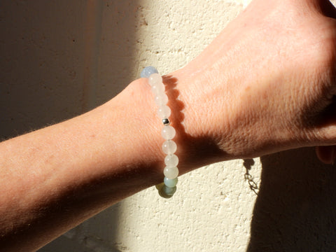Silver, White Jade, Amazonite and Angelite Bracelet on someone's wrist