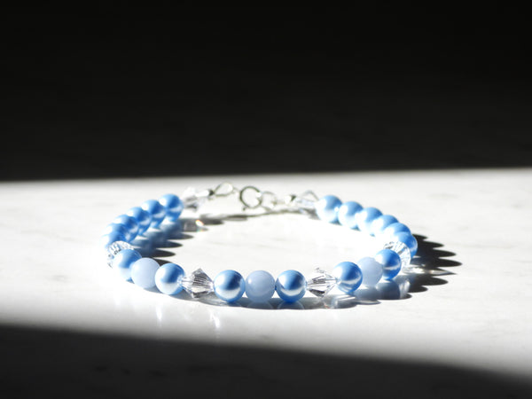 Blue princess bracelet with Swarovski pearls, swarovski crystals, angelite beads and sterling silver findings. Front view